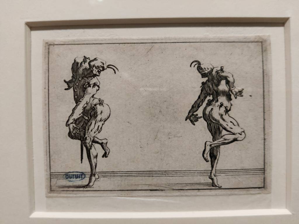 Dessin noir de deux personnages caricaturaux dansant